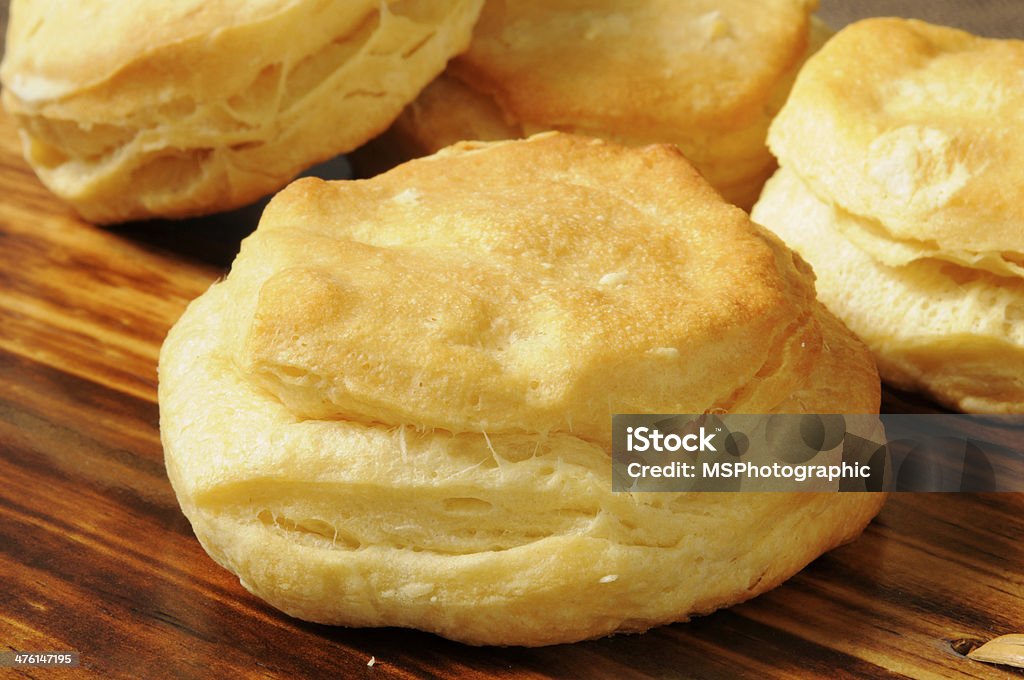 Fresh baked biscuit Fresh baked buttermilk biscuits cooling on a cutting board Biscuit - Quick Bread Stock Photo