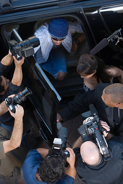 istock Male Celebrity And Paparazzi 476147365