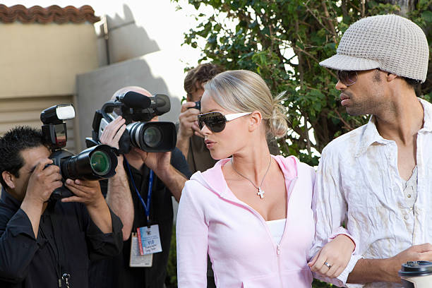 istock Celebrity Couple And Paparazzi 476147419