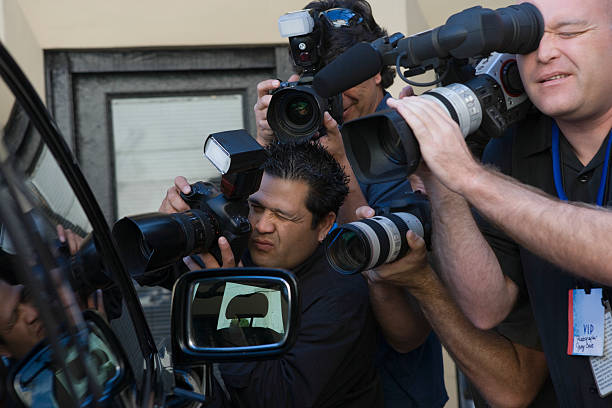 istock Paparazzi Photographers At Car Window 476147429