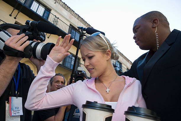 istock Celebrity With Bodyguard And Paparazzi 476147435