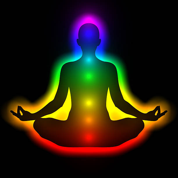 Woman in meditation with aura and chakras Illustration of silhouette of woman in meditation with aura and chakras. Theme of healing energy, connection between the body and soul. chakra photos stock pictures, royalty-free photos & images