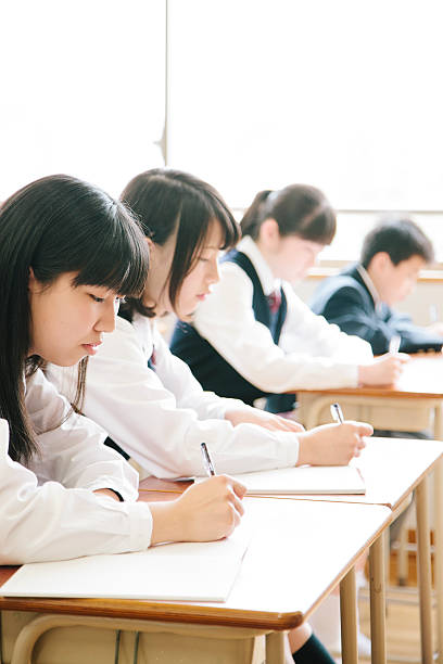 istock High school students, four teenagers working in a classroom, Japan 476152500