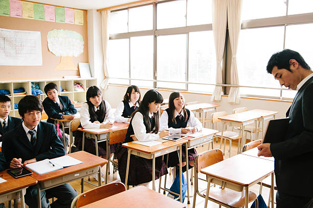 istock High school class and teacher with tablet computer, Japan 476152574