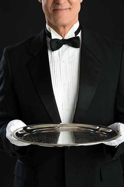 istock Midsection Of Waiter Holding Serving Tray 476154975