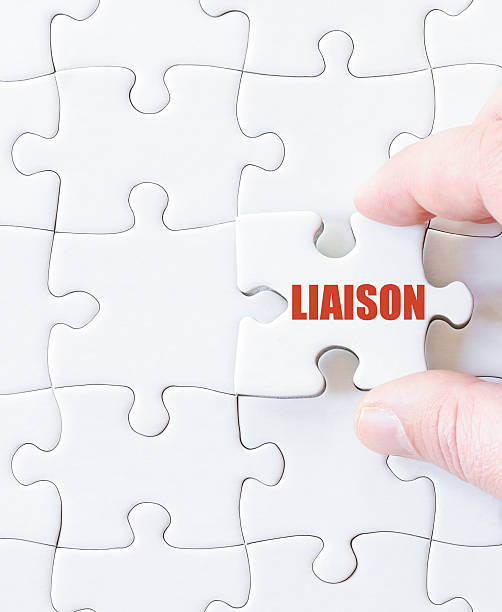 istock Last puzzle piece with word LIAISON 476155816