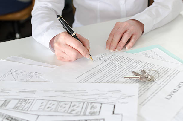 istock Client signing a real estate contract 476156080