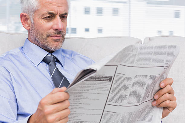 istock Businessman reading the news 476156577