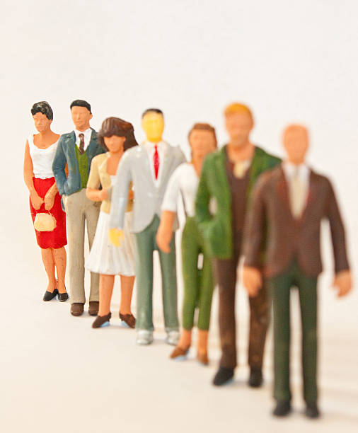 istock Queue of figures with focus on the last figure 476157651