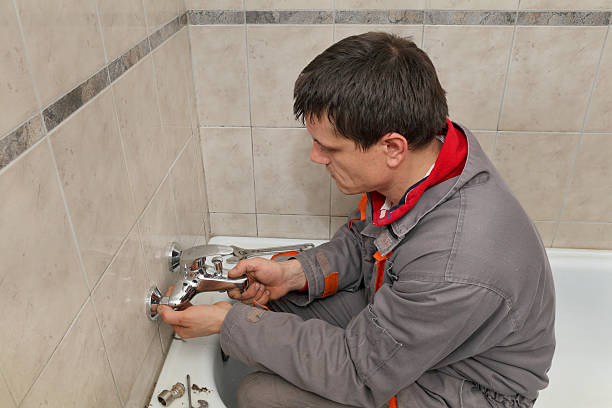 istock Plumber works in a bathroom 476160478