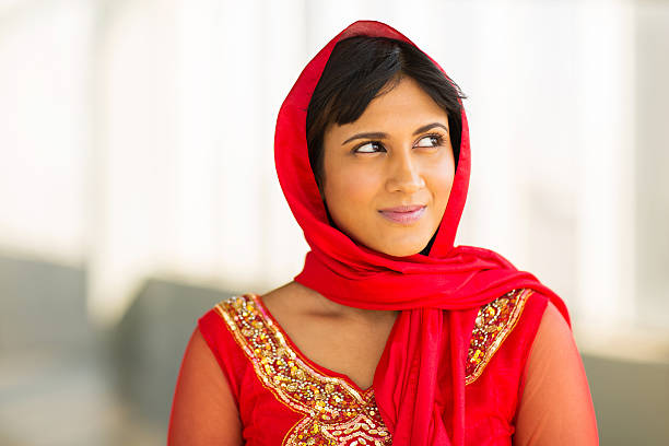 istock young indian woman looking to the side 476160536