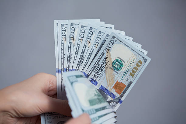 istock Money in female hands 476160588