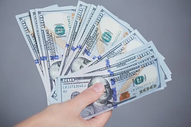 istock Money in female hands 476160590