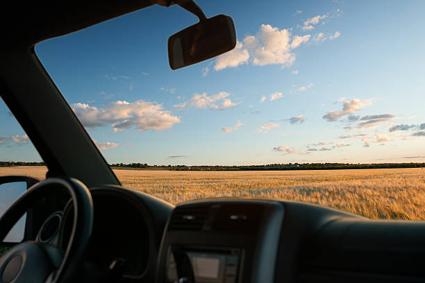 istock view from car window on the field at sunset 476164704