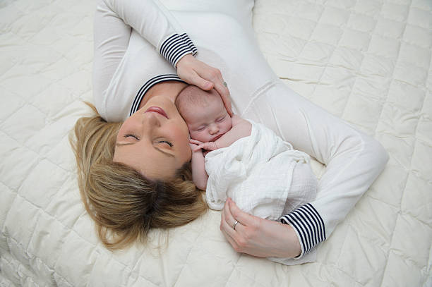 istock Mother and her Newborn Daughter 476164719