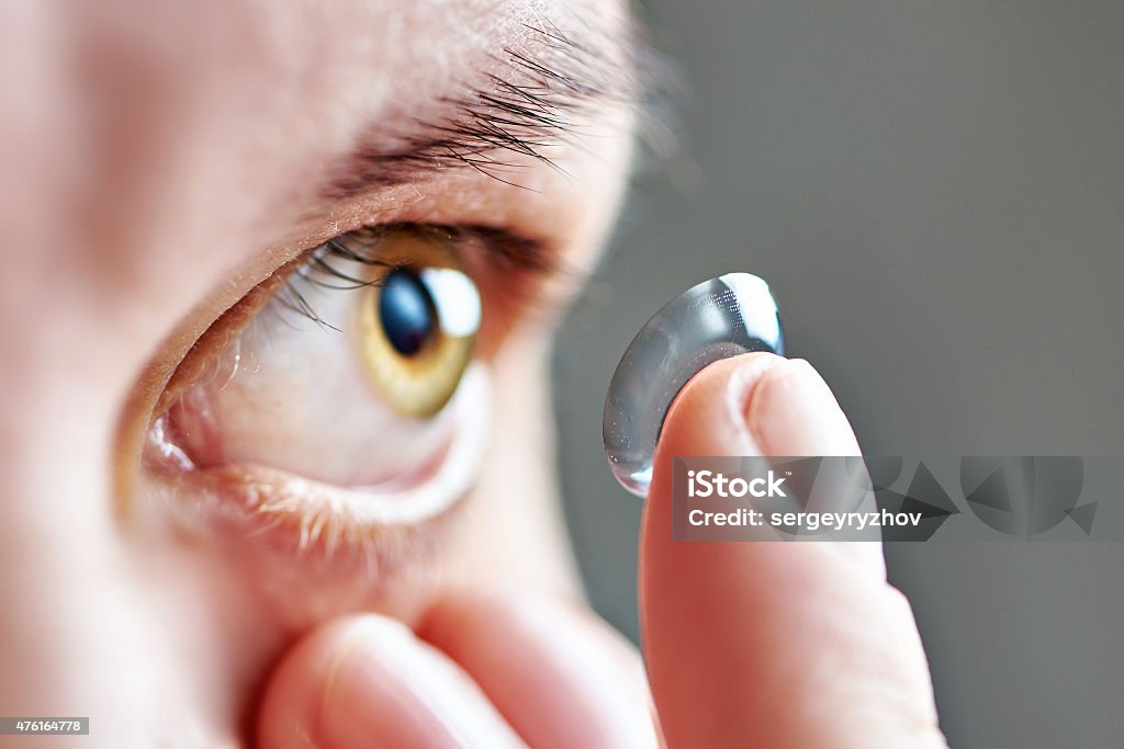 Young woman with contact lens Medicine and vision - young woman with contact lens Contact Lens Stock Photo