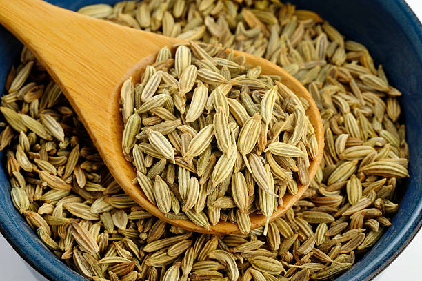 istock Fennel seeds in wooden spoon 476165720