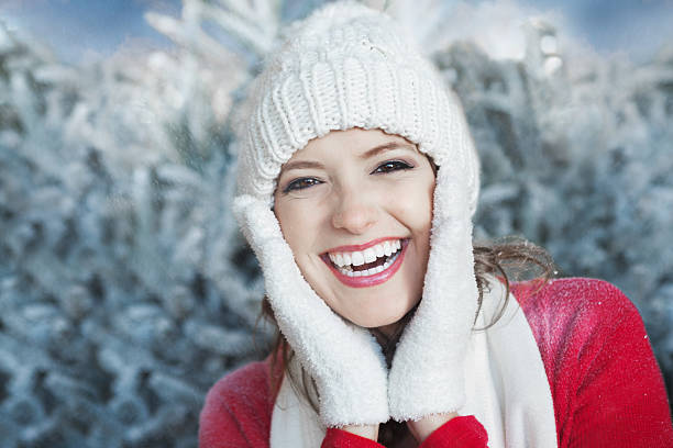 istock Pretty woman smiling outdoors on snowy day 476166253