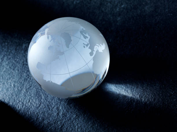 istock Glass Globe of the World on Grey Slate 476166889