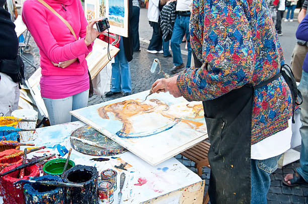 Artist painting a picture of a tourist