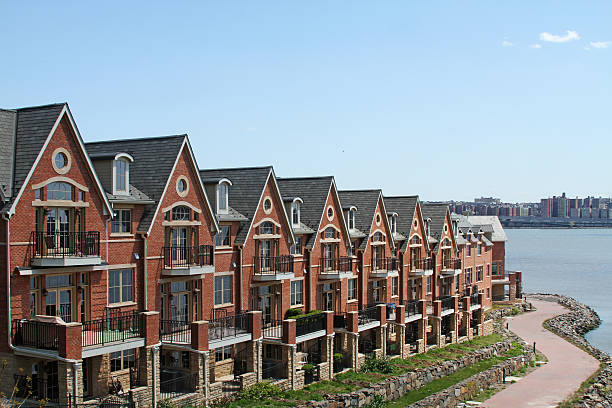 istock Townhouses with walkway and water 476173171