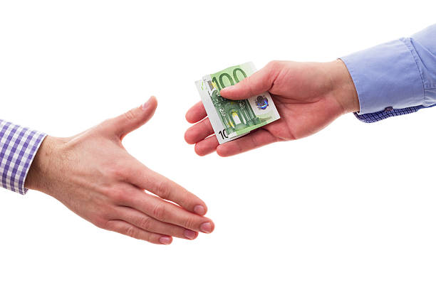 istock Handshakes with money 476173325