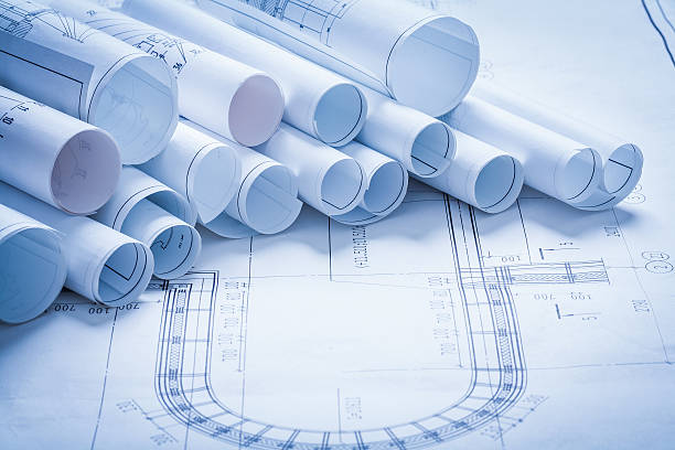 istock Variety of rolled up construction plans building and architectur 476173534