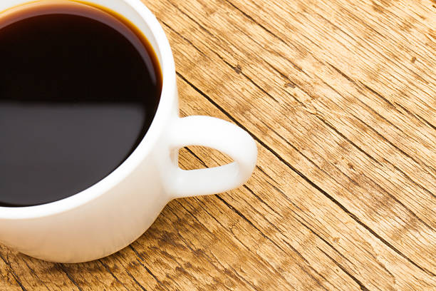 istock Cup of black coffee on old wooden table 476173772