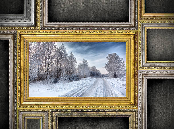 istock golden wooden frame with beautiful landscape among other empty frames 476174463