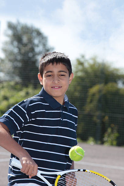 istock Boy playing a game of tennis 476175345