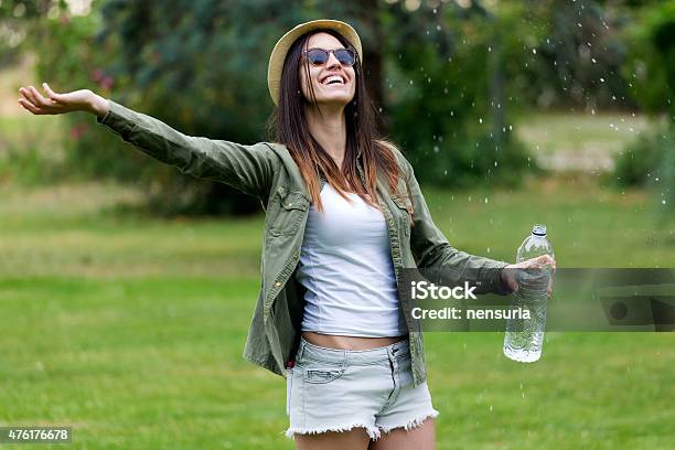 Beautiful Young Woman Enjoying Summer With Water Stock Photo - Download Image Now - Below, Rain, Smiling