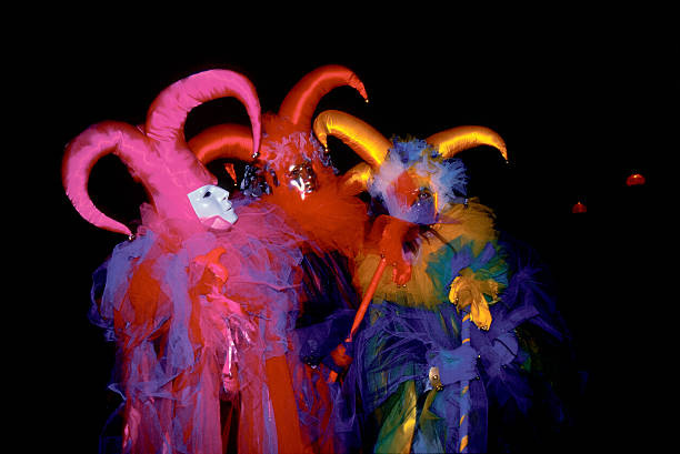 Birthday party. Friends, stylish emotion men tied with decorations, celebrating against yellow background. Concept of leisure, vacation, emotions, friendship, fun, bachelor party