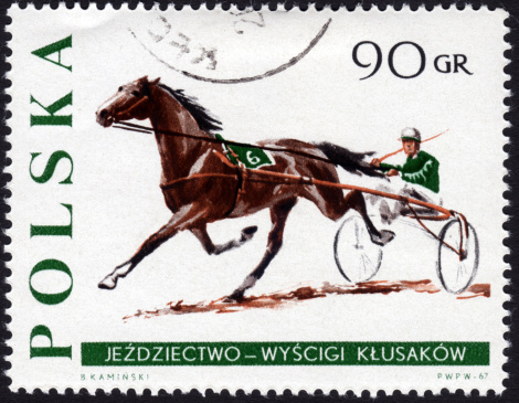 Polish postage stamp ca. 1967 showing the sport of harness horse racing with horse, jockey and sulky