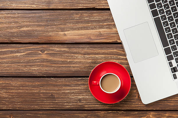 istock Cup of coffee and laptop computer 476180668