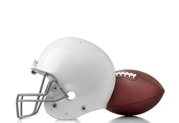 Football Football helmet and ball on white background.  Please see my portfolio for other football and sport images. football helmet and ball stock pictures, royalty-free photos & images