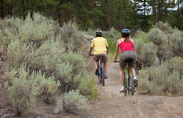 istock Couple Riding Bikes in a Forest 476182809