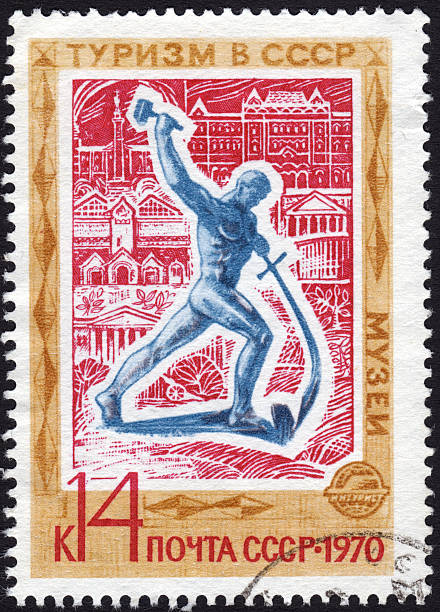 Postage stamp showing sculpture of man with hammer and sword Postage stamp USSR ca. 1970 shows a sculpture of a man with a hammer who turn a sword into a plowshare geochelone yniphora stock pictures, royalty-free photos & images