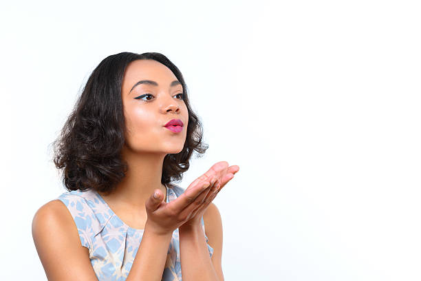 istock Pretty girl blowing kiss 476184278