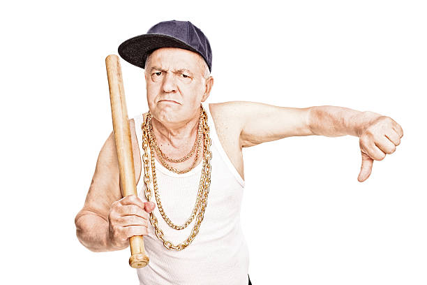 istock Violent senior with baseball bat giving a thumb down 476184818