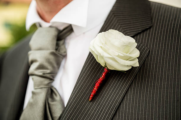 groom hands holding beautiful wedding bouquet