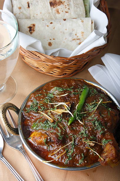 istock Boneless diced chicken cooked in a traditional Kadhai (wok) 476185149
