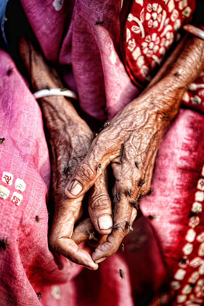 istock old lady wrinkled hand with flyer 476195487