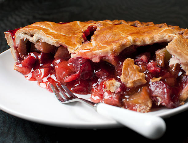 Strawberry and rhubarb pie piece closeup