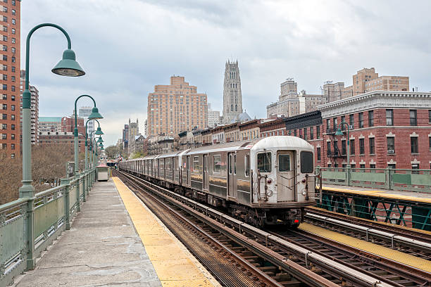 istock Train Approaching  Elevated Subway Station in Harlem, New York 476196270
