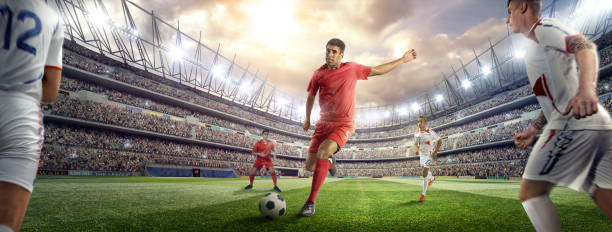 istock Soccer player kicking ball in stadium 476196330