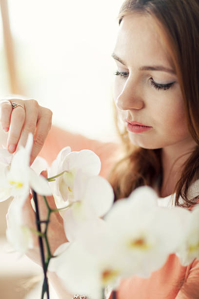 istock Woman With White Orchid 476196346