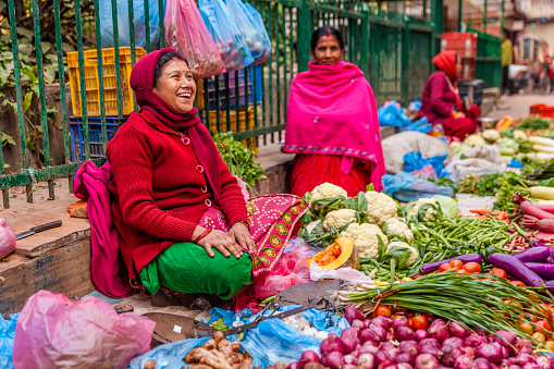 Mandalay, Myanmar - Feb 23, 2016. A woman selling vegetables at local market in Mandalay, Myanmar. Mandalay is the second largest city in Burma, and a former capital of Myanmar.