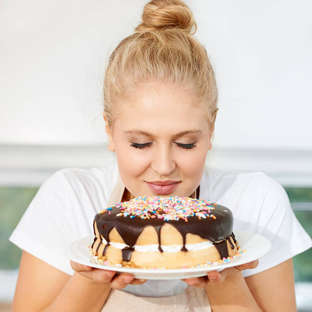 Mmm This Smells Amazing Stock Photo - Download Image Now - Smelling, Cake, One Woman Only - iStock