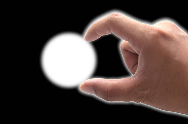 istock Human hand keeping something with two fingers 476199674