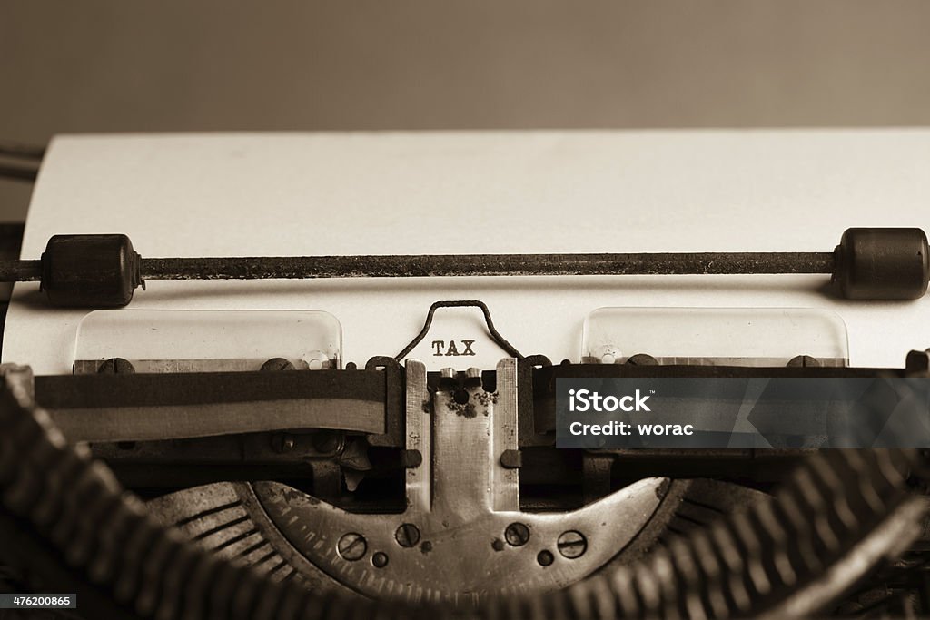 Tax letter Word "TAX" on white paper in the old typewriter Business Stock Photo